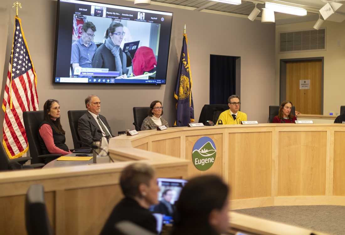 Eugene City Council members seated at the dais in council chambers